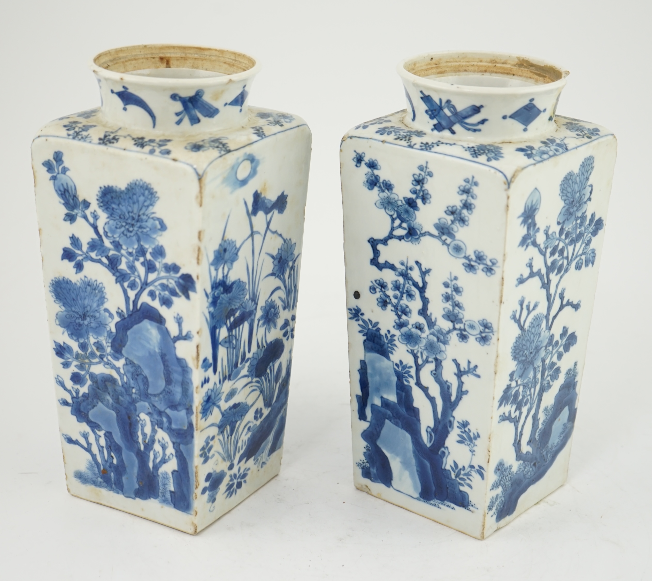 A pair of Chinese blue and white square section vases, Kangxi period